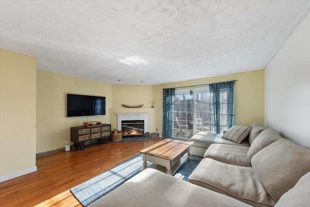 202 Essex Ct, Brewster, NY 10509 - living room featuring a textured ceiling and hardwood / wood-style flooring