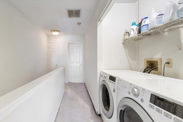 202 Essex Ct, Brewster, NY 10509 - laundry area with washer and clothes dryer and light colored carpet
