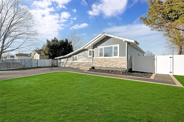 view of property exterior with a yard