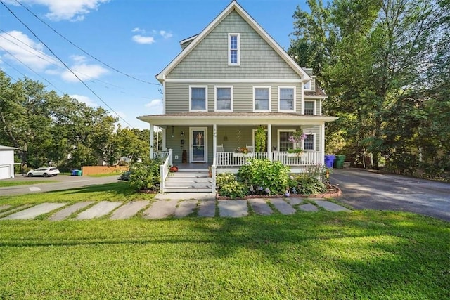 view of front facade featuring a porch and a front yard