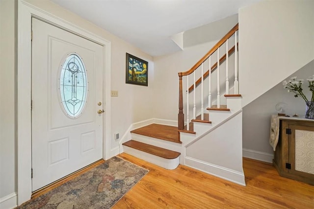 foyer entrance with light hardwood / wood-style floors