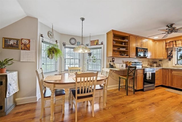 dining room featuring ceiling fan and light wood-type flooring