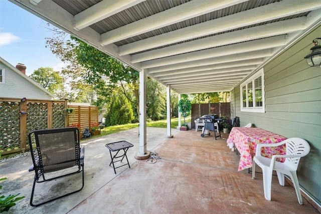 view of patio featuring a grill