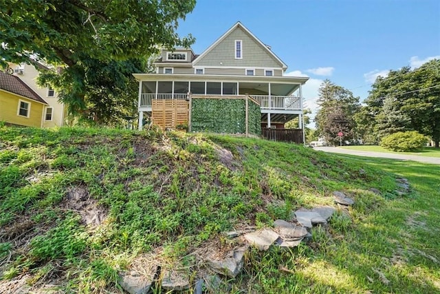 back of property featuring a sunroom