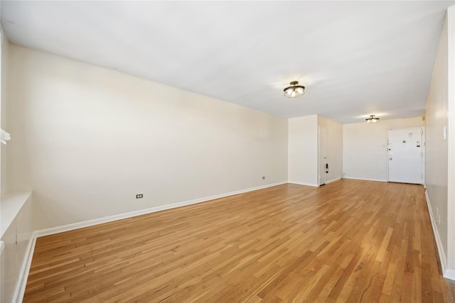 spare room with light hardwood / wood-style flooring