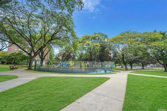 view of property's community featuring a yard