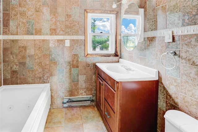 bathroom with tile patterned flooring, a tub to relax in, toilet, vanity, and tile walls