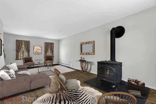 living room with a wood stove, dark hardwood / wood-style floors, and a baseboard heating unit