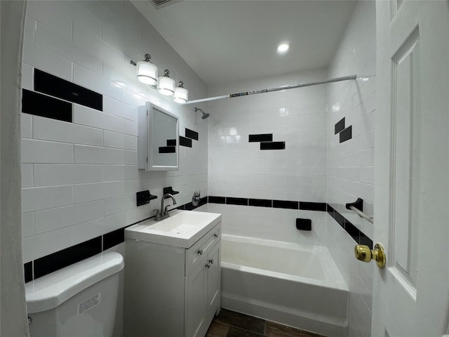 full bathroom featuring tub / shower combination, backsplash, toilet, vanity, and tile walls