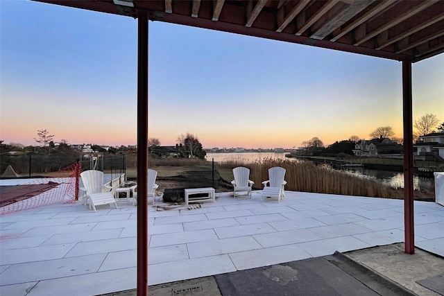 view of patio terrace at dusk