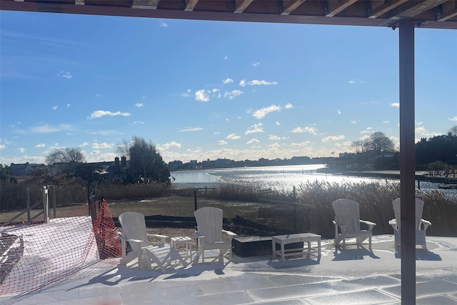 view of patio featuring a water view