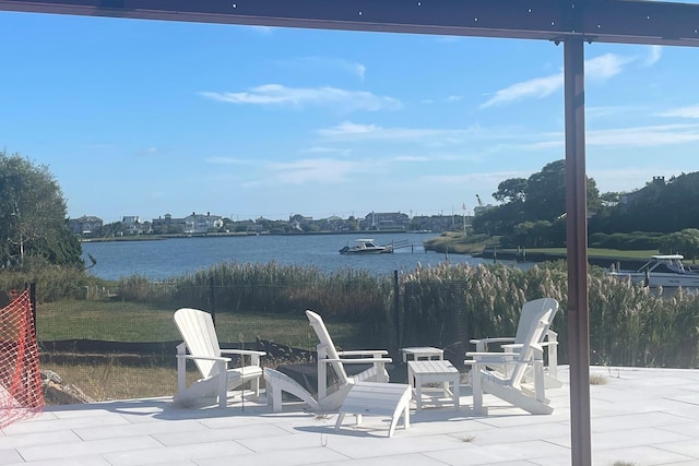 view of patio with a water view