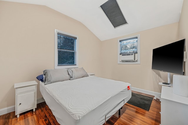 bedroom with dark hardwood / wood-style floors, vaulted ceiling, and cooling unit