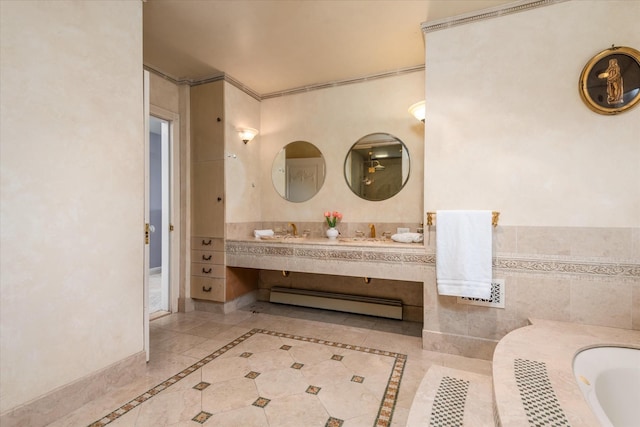 bathroom with tile patterned floors, vanity, a tub, and a baseboard radiator