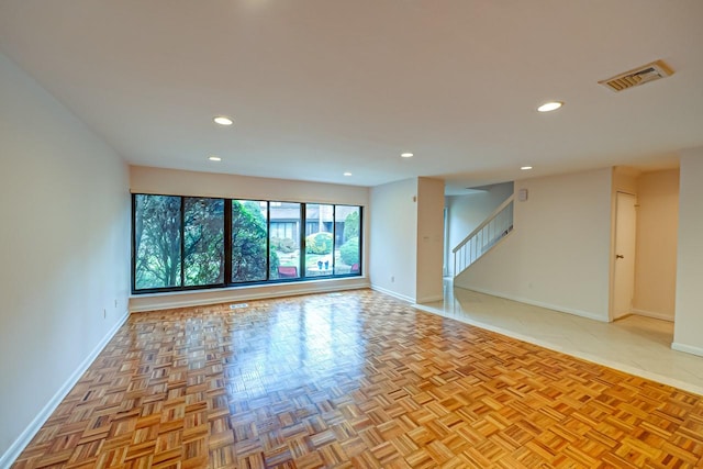 spare room with light parquet floors