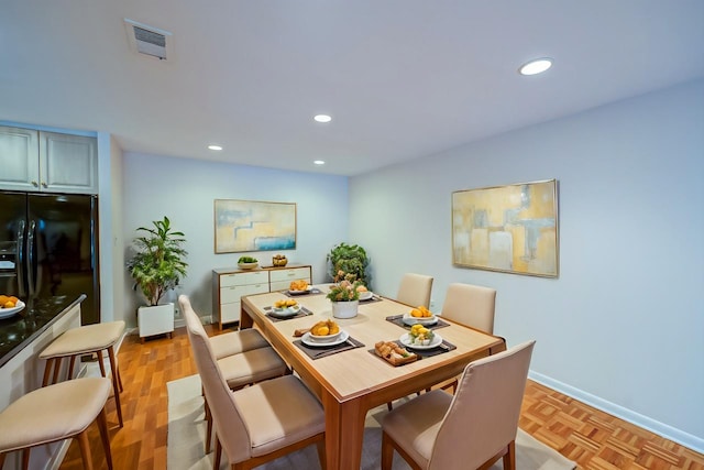 dining area with light parquet floors