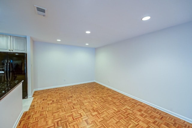 empty room with light parquet floors