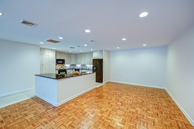 kitchen featuring kitchen peninsula, light parquet floors, decorative backsplash, white cabinets, and black appliances