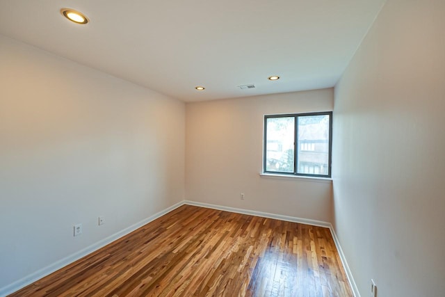 empty room featuring hardwood / wood-style flooring