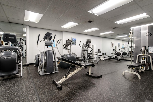 exercise room with a drop ceiling