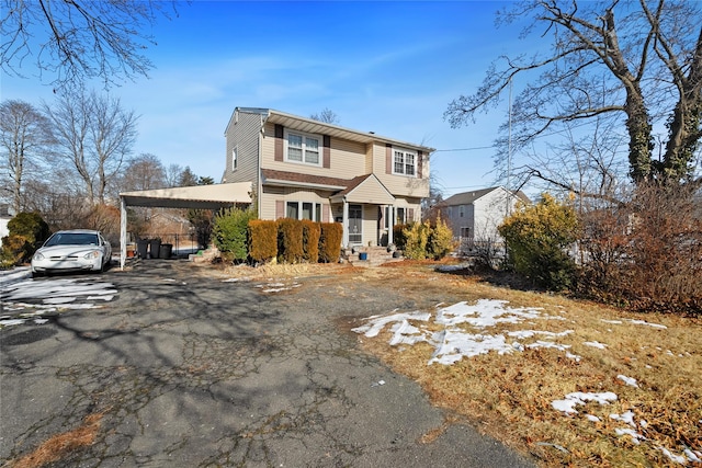 view of front property featuring a carport