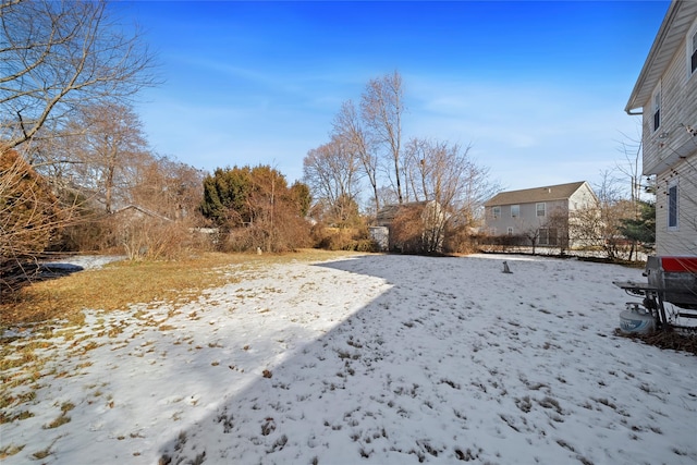 view of yard layered in snow