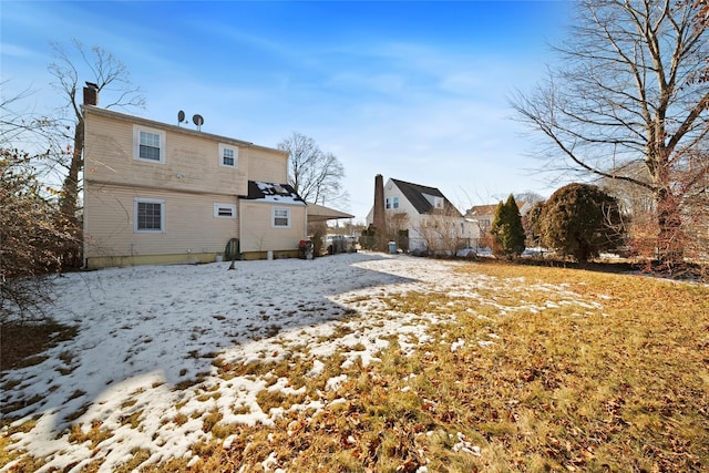 view of snow covered house