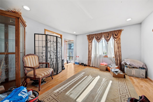 sitting room with hardwood / wood-style floors