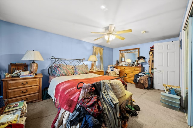 bedroom featuring ceiling fan and light colored carpet