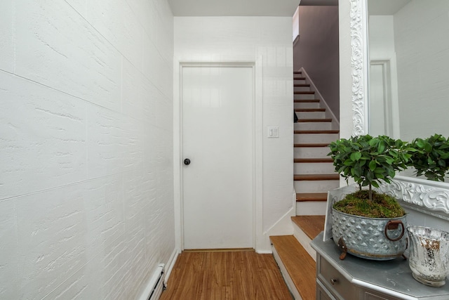 stairway featuring hardwood / wood-style flooring