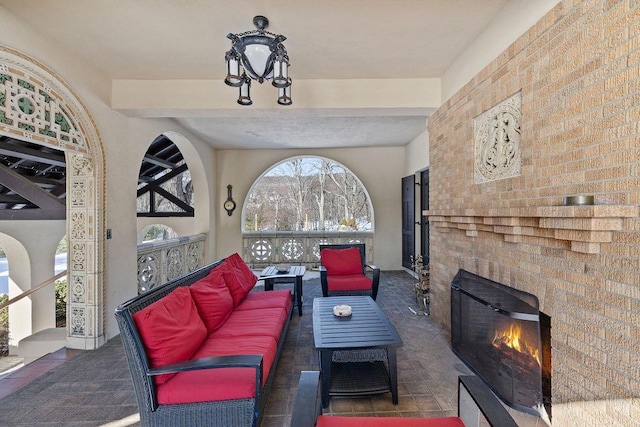 view of patio / terrace featuring an outdoor living space with a fireplace