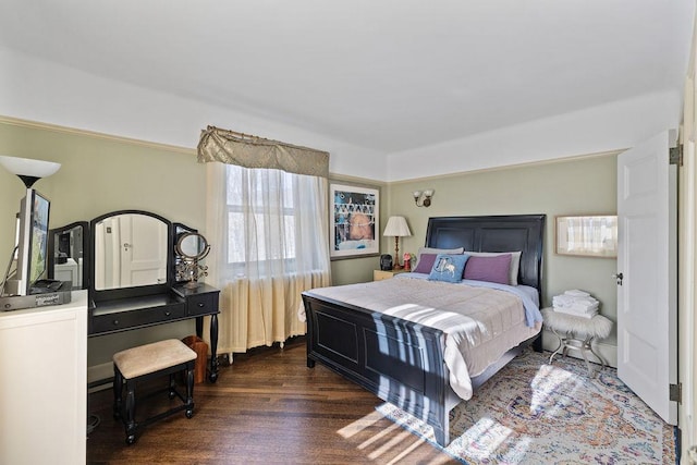 bedroom with dark wood-style floors