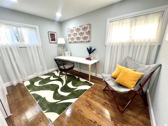 office area featuring wood finished floors and baseboards