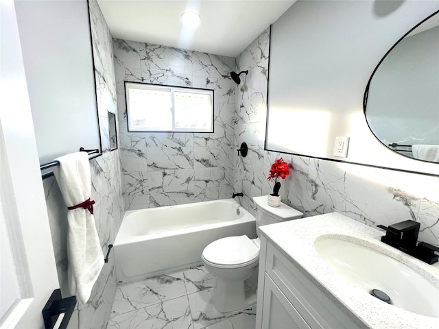 full bathroom featuring toilet, vanity, tile walls, marble finish floor, and washtub / shower combination