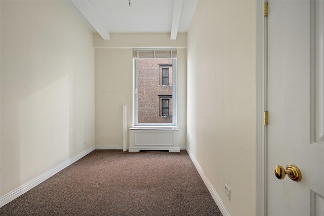 unfurnished room with beamed ceiling, carpet flooring, and a healthy amount of sunlight