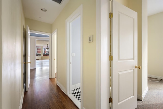 hallway featuring dark hardwood / wood-style floors