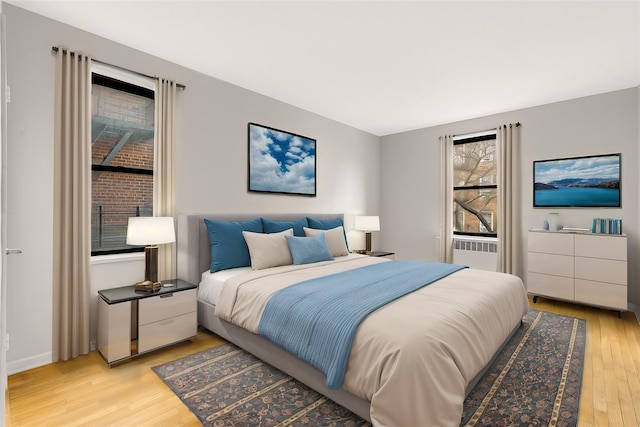 bedroom with light hardwood / wood-style flooring