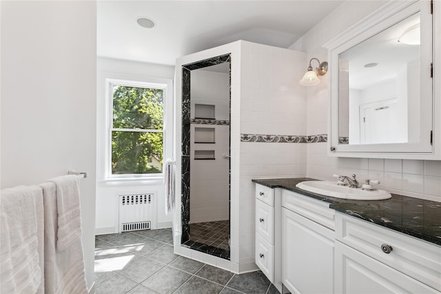 109 Argyll Ave, New Rochelle, NY 10804 - full bath with radiator, vanity, a stall shower, and tile patterned flooring