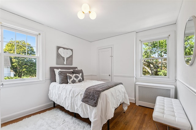 109 Argyll Ave, New Rochelle, NY 10804 - bedroom with radiator heating unit and hardwood / wood-style flooring