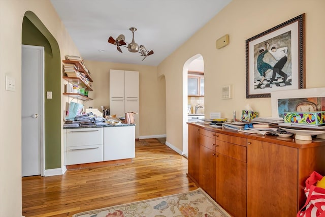 kitchen featuring white cabinetry and light hardwood / wood-style floors