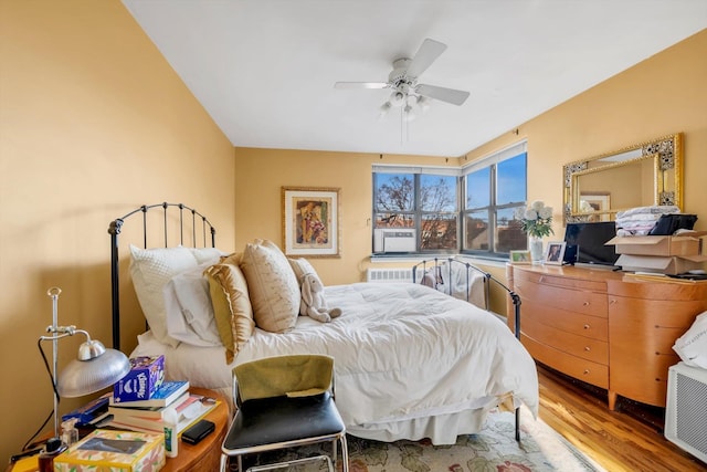 bedroom with ceiling fan and wood-type flooring