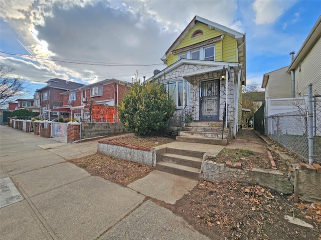 129-06 131st St, South Ozone Park, NY 11420 - view of front of property featuring stone siding and a residential view