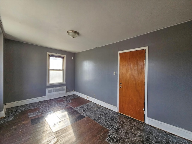 129-06 131st St, South Ozone Park, NY 11420 - spare room with radiator and baseboards