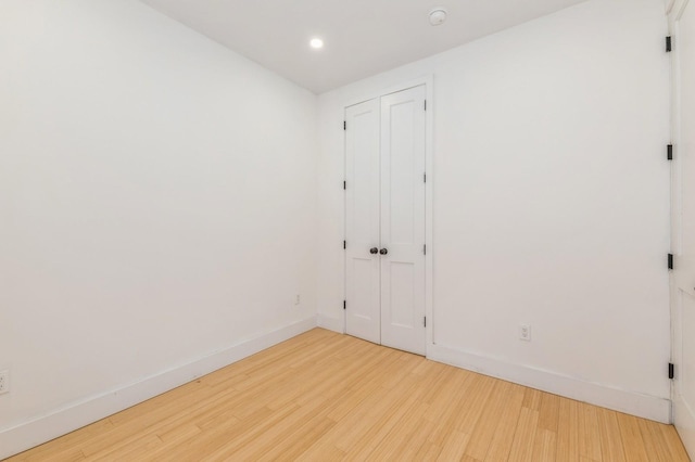 spare room featuring hardwood / wood-style floors