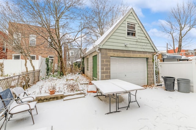 view of snow covered garage