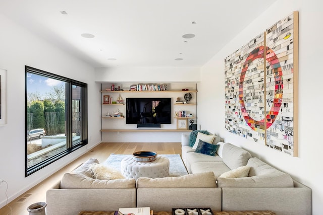 living room with light hardwood / wood-style floors