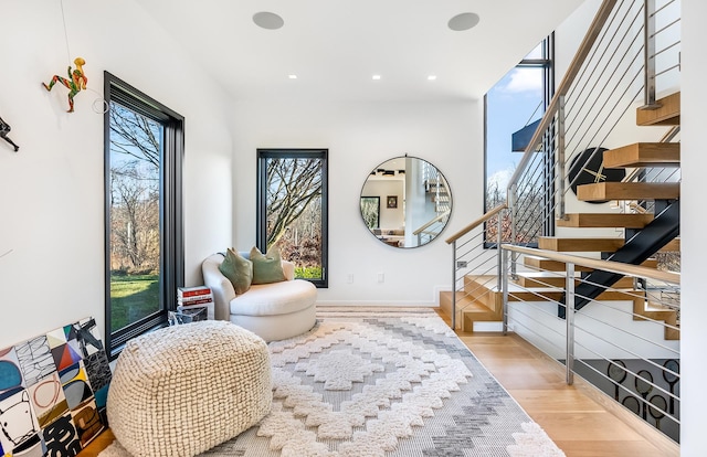 living area with a healthy amount of sunlight and light wood-type flooring