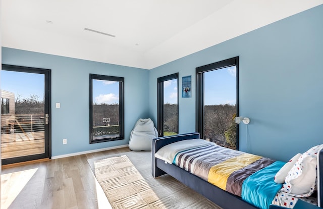 bedroom with light hardwood / wood-style floors