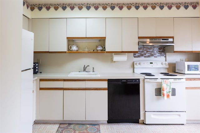 2555 Youngs Unit 7D, Southold, NY 11971 - kitchen featuring white appliances, extractor fan, light countertops, a sink, and open shelves