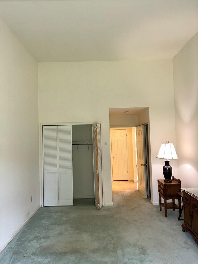 2555 Youngs Unit 7D, Southold, NY 11971 - bedroom featuring light colored carpet, a closet, and baseboards